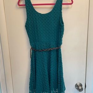 Small teal crocheted Lily Rose dress.